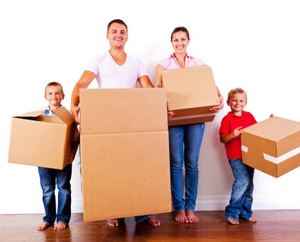 Packing fragile household items for a move in Aldwych